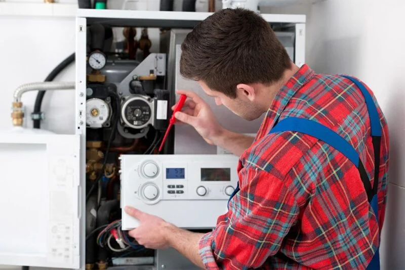 sherman oaks-plumber-repairing-a-water-heater-in-california-home